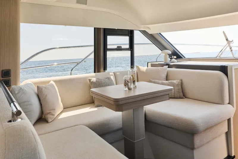  Yacht Photos Pics Manufacturer Provided Image: Luxurious interior of 2026 Prestige F4.3 yacht with ocean view and elegant seating area.