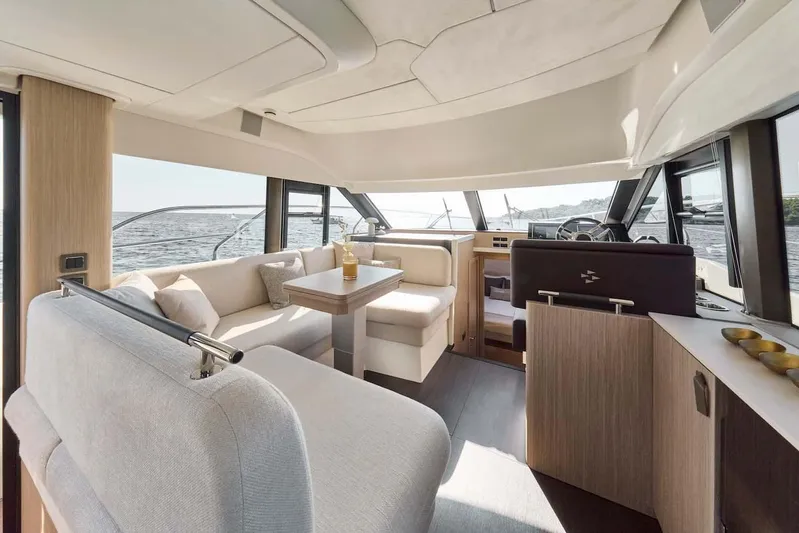  Yacht Photos Pics Manufacturer Provided Image: Luxurious interior of 2026 Prestige F4.3 yacht with elegant seating and panoramic windows.
