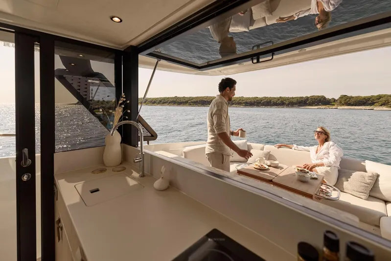  Yacht Photos Pics Manufacturer Provided Image: Couple enjoying breakfast on a Prestige F4.3 yacht, 2026 model, with ocean view.