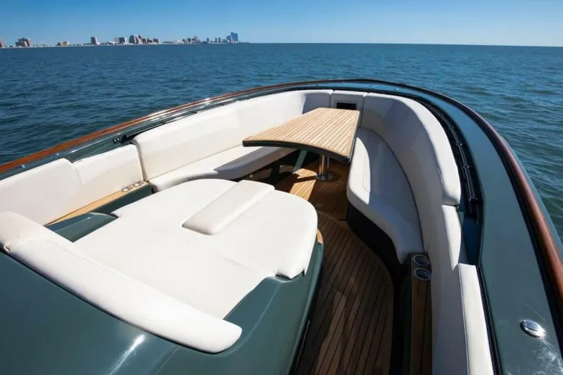  Yacht Photos Pics Luxurious 2026 Buddy Davis Pininfarina yacht interior with elegant seating and wooden table.