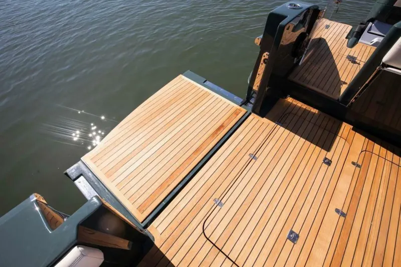  Yacht Photos Pics Luxury 2026 Buddy Davis Pininfarina boat deck with sleek wooden finish on water.