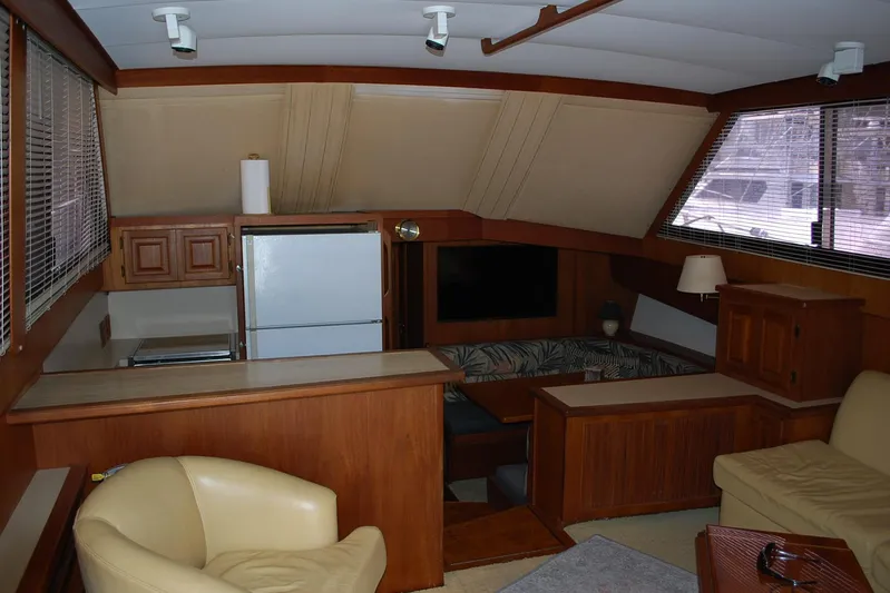 2 Jay's Yacht Photos Pics Interior of 1988 Viking 45 Convertible yacht with wood paneling and modern amenities.