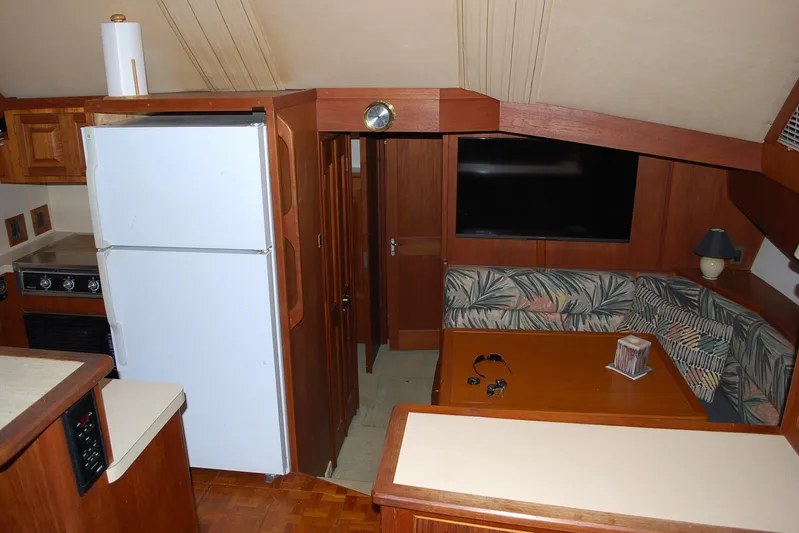 2 Jay's Yacht Photos Pics Interior of 1988 Viking 45 Convertible yacht with kitchen and seating area.