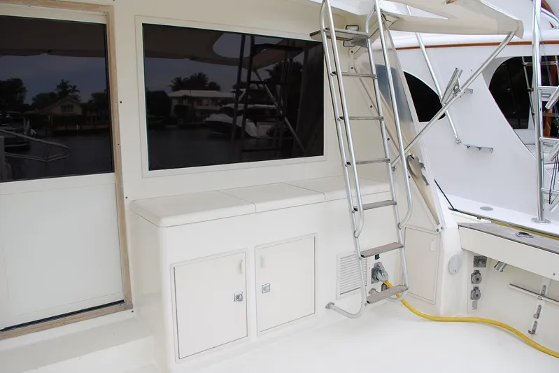 2 Jay's Yacht Photos Pics 1988 Viking 45 Convertible yacht deck with ladder and storage compartments.