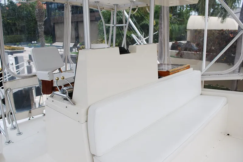 2 Jay's Yacht Photos Pics 1988 Viking 45 Convertible yacht interior with white seating and helm station.