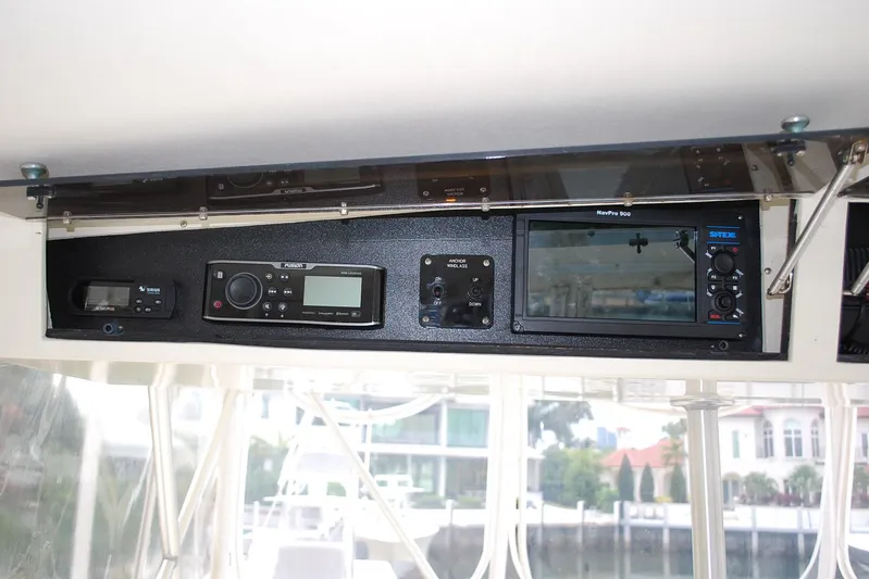 2 Jay's Yacht Photos Pics 1988 Viking 45 Convertible boat dashboard with navigation and communication equipment.