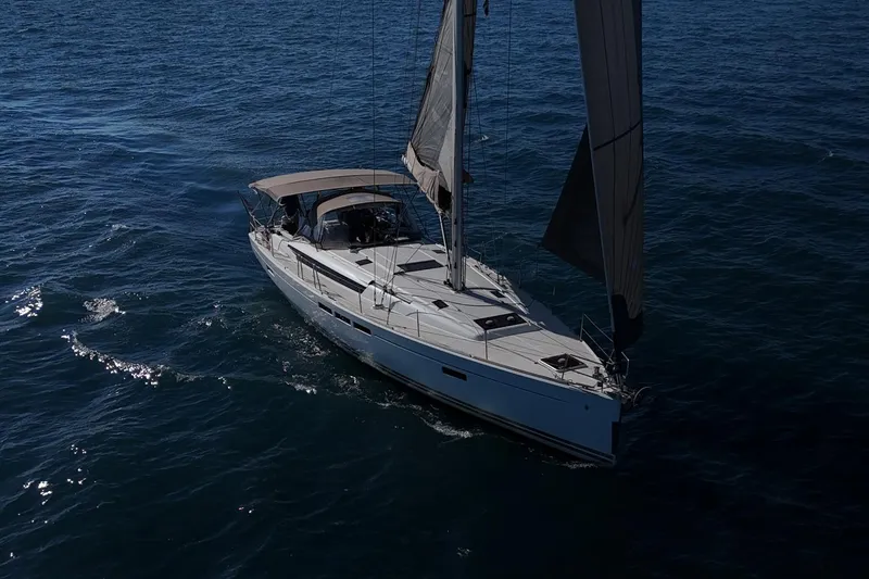 Marley 2 Yacht Photos Pics 2012 Jeanneau Sun Odyssey 509 sailing on open water, showcasing elegant design and performance.