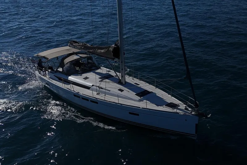 Marley 2 Yacht Photos Pics 2012 Jeanneau Sun Odyssey 509 sailing on open water, showcasing sleek design and elegance.