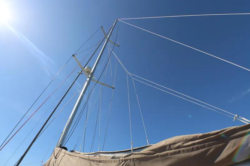Marley 2 Yacht Photos Pics Mast and rigging of 2012 Jeanneau Sun Odyssey 509 sailboat against clear blue sky.