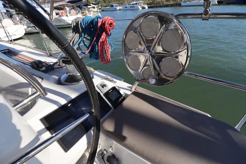 Marley 2 Yacht Photos Pics Cockpit view of 2012 Jeanneau Sun Odyssey 509 sailboat with ropes and steering wheel.