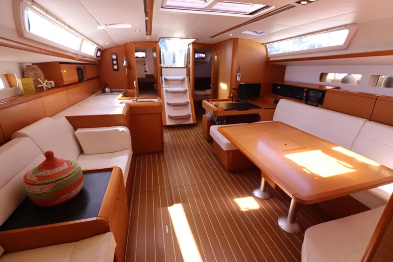 Marley 2 Yacht Photos Pics Luxurious interior of 2012 Jeanneau Sun Odyssey 509 yacht with elegant wood finish and seating.