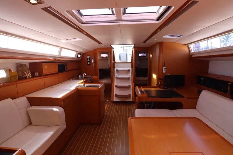 Marley 2 Yacht Photos Pics Luxurious interior of 2012 Jeanneau Sun Odyssey 509 yacht with modern amenities and elegant design.