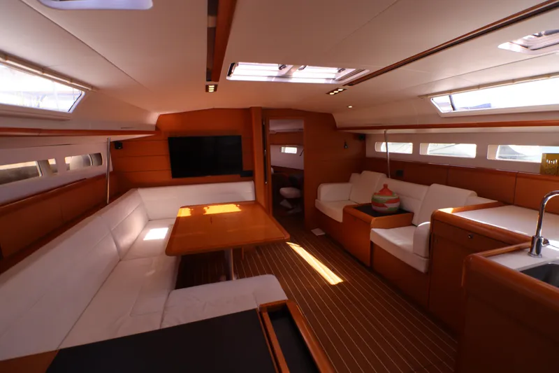 Marley 2 Yacht Photos Pics Luxurious interior of 2012 Jeanneau Sun Odyssey 509 yacht with elegant seating and modern amenities.