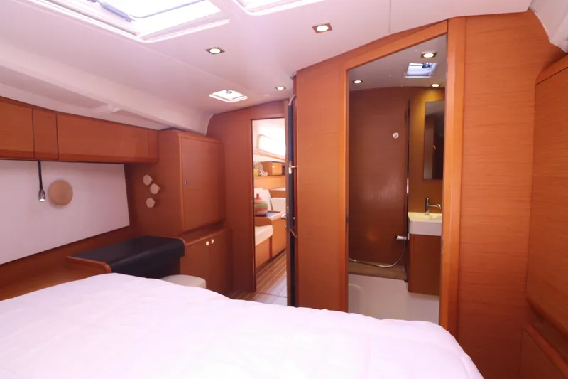 Marley 2 Yacht Photos Pics Interior of 2012 Jeanneau Sun Odyssey 509 yacht, featuring cozy cabin and modern bathroom.