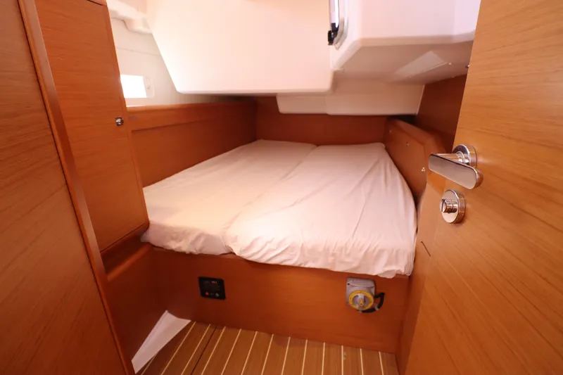 Marley 2 Yacht Photos Pics Cozy cabin interior of 2012 Jeanneau Sun Odyssey 509 sailboat with wooden finish.