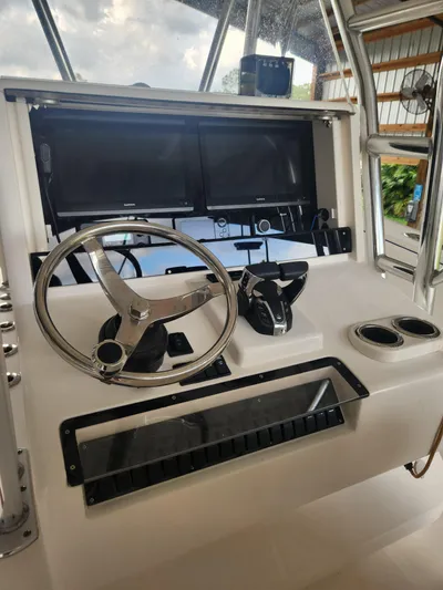  Yacht Photos Pics 2013 Invincible 36 Open Fisherman helm with dual screens and steering wheel.