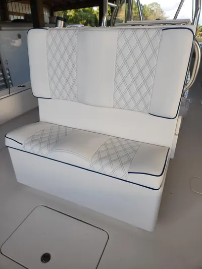  Yacht Photos Pics 2013 Invincible 36 Open Fisherman boat seat with diamond-patterned upholstery.