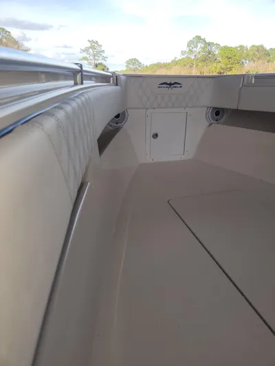  Yacht Photos Pics 2013 Invincible 36 Open Fisherman boat interior with cushioned seating and storage.