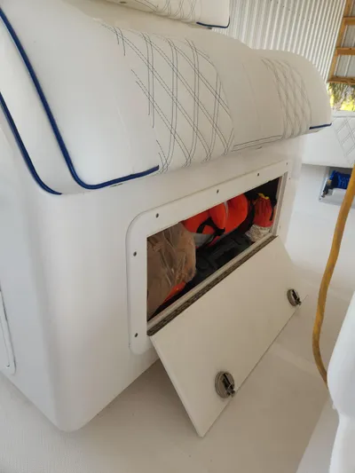 Yacht Photos Pics 2013 Invincible 36 Open Fisherman storage compartment with safety gear.