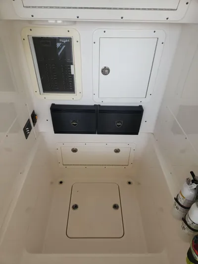  Yacht Photos Pics 2013 Invincible 36 Open Fisherman interior with storage compartments and control panel.