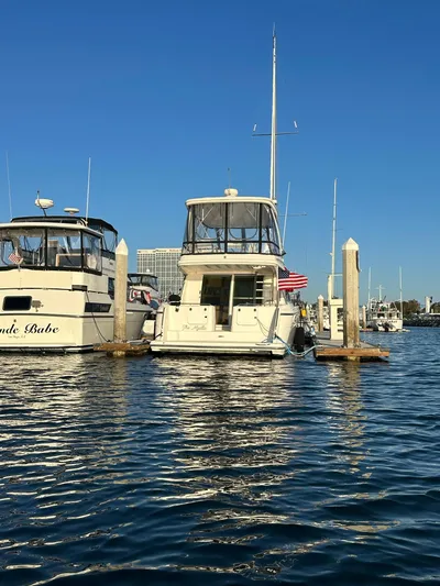 The Mystic Yacht Photos Pics 2001 Maxum 4600 SCB Limited Edition yacht docked in a marina under clear blue skies.