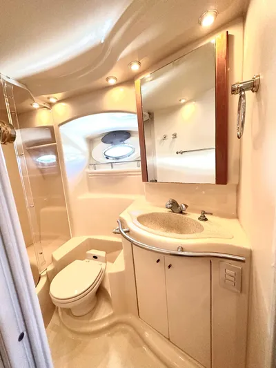 The Mystic Yacht Photos Pics Luxurious bathroom in 2001 Maxum 4600 SCB Limited Edition yacht with modern fixtures.