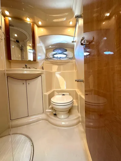 The Mystic Yacht Photos Pics Luxurious bathroom in 2001 Maxum 4600 SCB Limited Edition yacht, featuring modern fixtures.