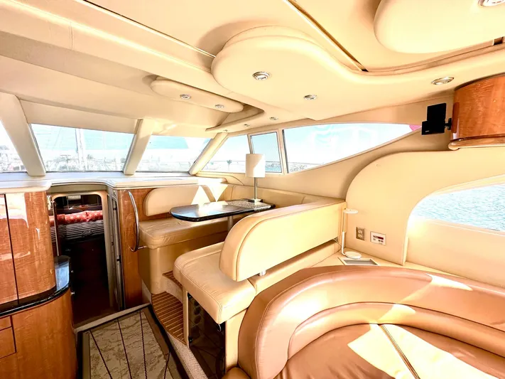 The Mystic Yacht Photos Pics Luxurious interior of 2001 Maxum 4600 SCB Limited Edition yacht with elegant seating and wood finishes.