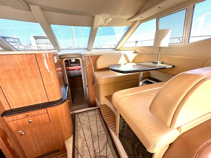 The Mystic Yacht Photos Pics Luxurious interior of 2001 Maxum 4600 SCB yacht with leather seating and wooden finishes.