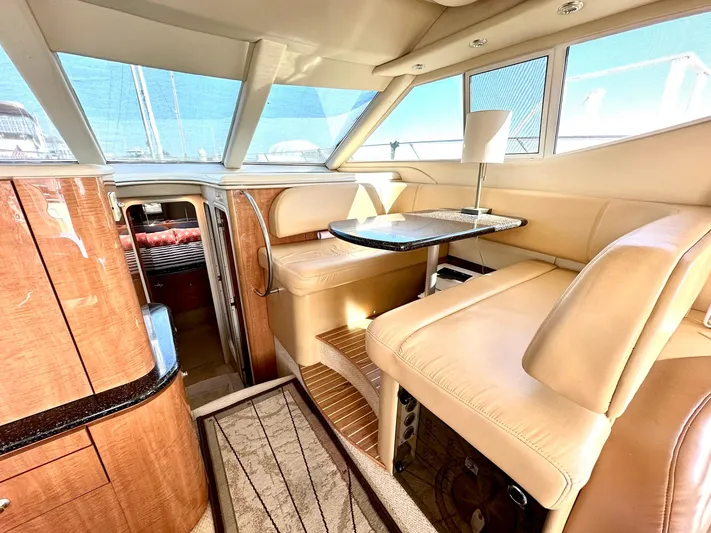 The Mystic Yacht Photos Pics Luxurious interior of 2001 Maxum 4600 SCB Limited Edition yacht with elegant seating and table.