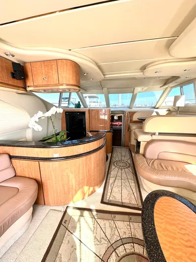 The Mystic Yacht Photos Pics Luxurious interior of 2001 Maxum 4600 SCB Limited Edition yacht with elegant wood finishes.