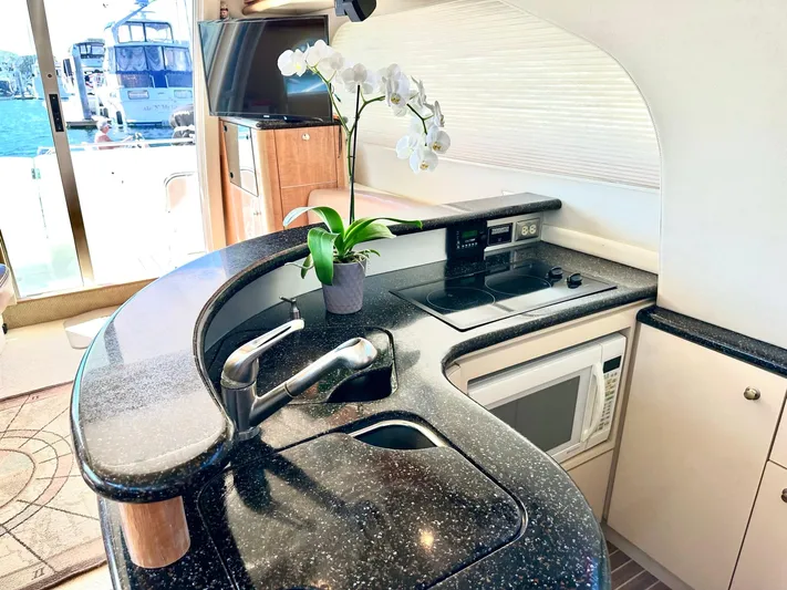 The Mystic Yacht Photos Pics Luxurious kitchen interior of 2001 Maxum 4600 SCB yacht with modern amenities.