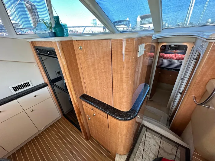 The Mystic Yacht Photos Pics Luxurious interior of 2001 Maxum 4600 SCB Limited Edition yacht with wood finishes and modern amenities.