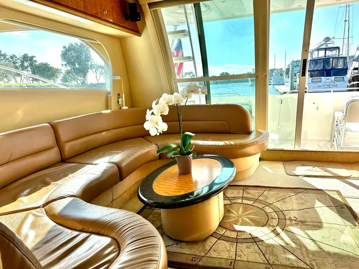 The Mystic Yacht Photos Pics Luxurious interior of 2001 Maxum 4600 SCB yacht with leather seating and scenic view.