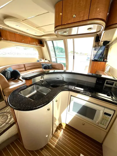 The Mystic Yacht Photos Pics 2001 Maxum 4600 SCB Limited Edition yacht interior with modern kitchen and seating area.