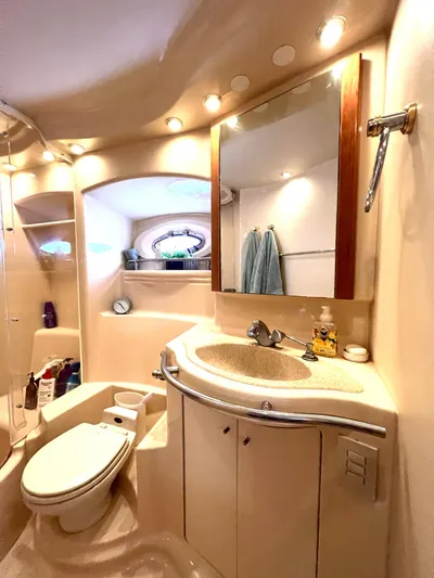 The Mystic Yacht Photos Pics Luxurious bathroom in 2001 Maxum 4600 SCB yacht, featuring modern fixtures and elegant lighting.