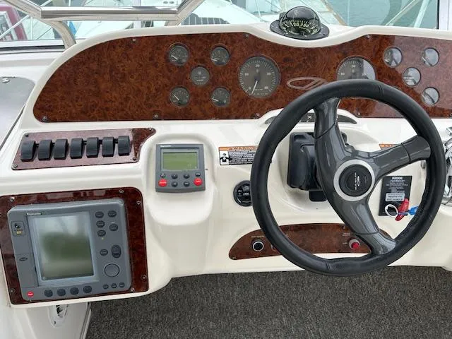 The Mystic Yacht Photos Pics Control panel of 2001 Maxum 4600 SCB Limited Edition boat with steering wheel and gauges.