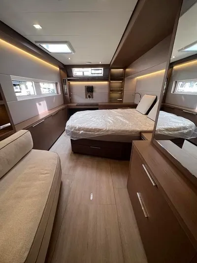  Yacht Photos Pics Luxurious interior of 2023 Lagoon 55 yacht with modern bedroom and elegant furnishings.