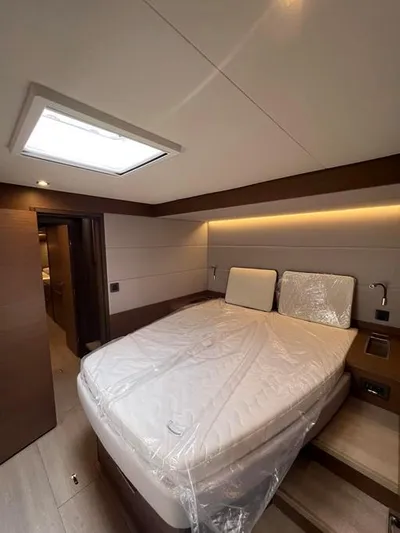  Yacht Photos Pics Luxurious cabin interior of 2023 Lagoon 55 yacht with modern design and ambient lighting.