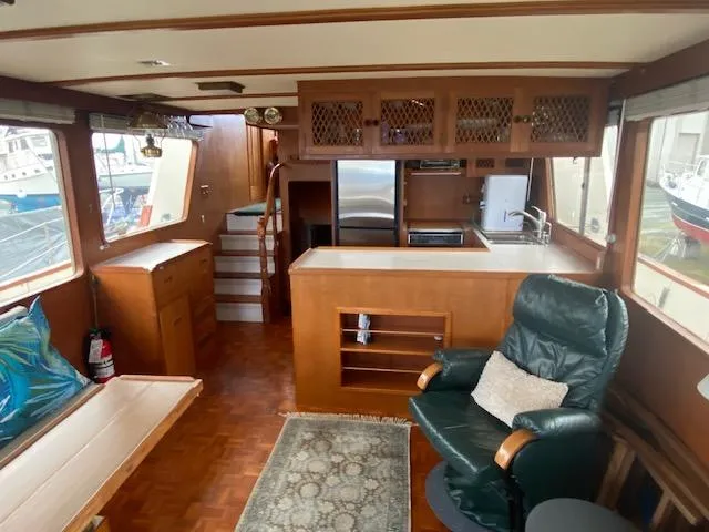  Yacht Photos Pics Interior of 1980 Ocean Alexander 50 MK1 yacht with wood finishes and comfortable seating.