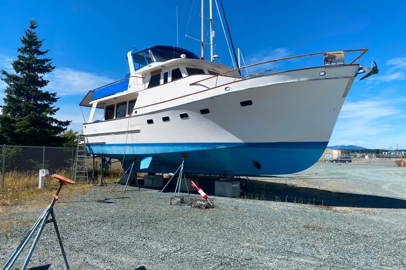  Yacht Photos Pics 1980 Ocean Alexander 50 MK1 yacht on dry dock under clear blue sky.