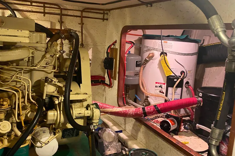  Yacht Photos Pics Engine room of 1980 Ocean Alexander 50 MK1 yacht with visible machinery and piping.