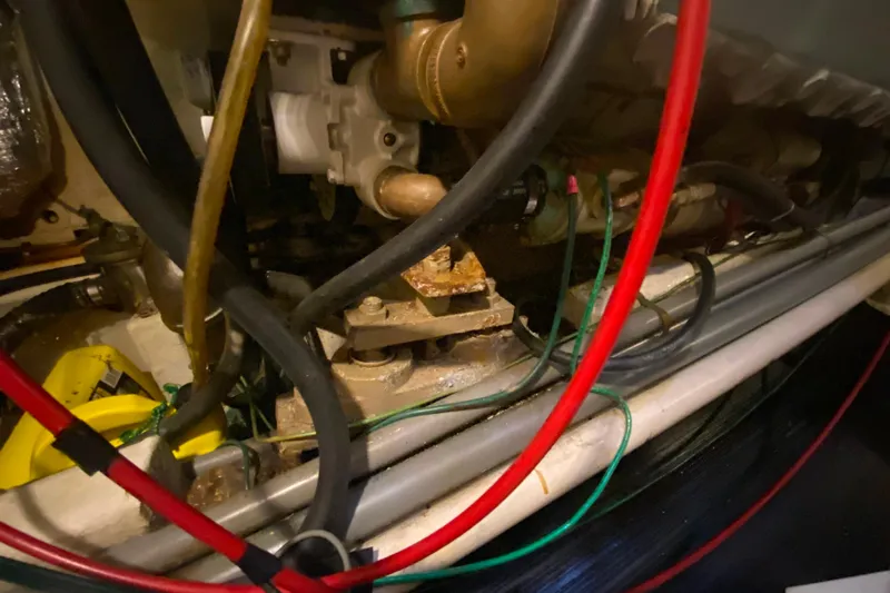  Yacht Photos Pics Engine compartment of 1980 Ocean Alexander 50 MK1 with visible hoses and components.