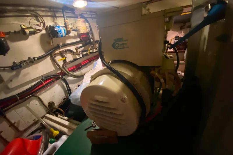  Yacht Photos Pics Engine room of 1980 Ocean Alexander 50 MK1 yacht with visible machinery and wiring.