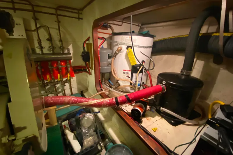  Yacht Photos Pics Engine room of 1980 Ocean Alexander 50 MK1 with plumbing and equipment.