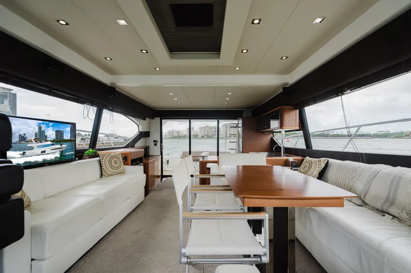 Worldwide Yacht Photos Pics Luxurious interior of 2014 Prestige 620 Fly yacht with elegant seating and dining area.