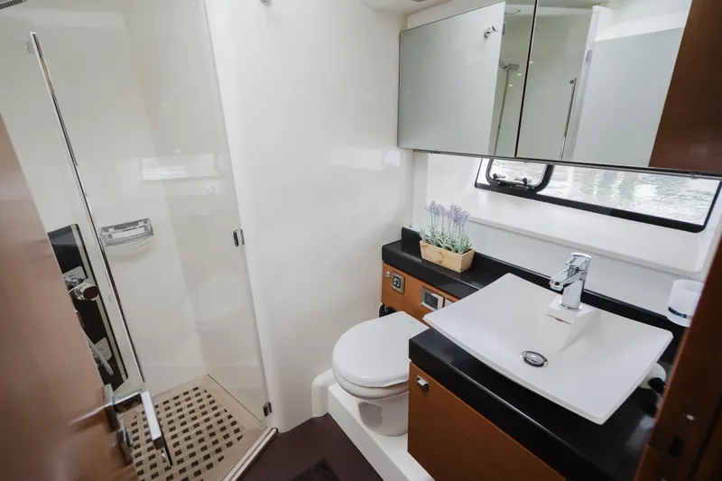 Worldwide Yacht Photos Pics Luxurious bathroom on 2014 Prestige 620 Fly yacht with modern fixtures and shower.