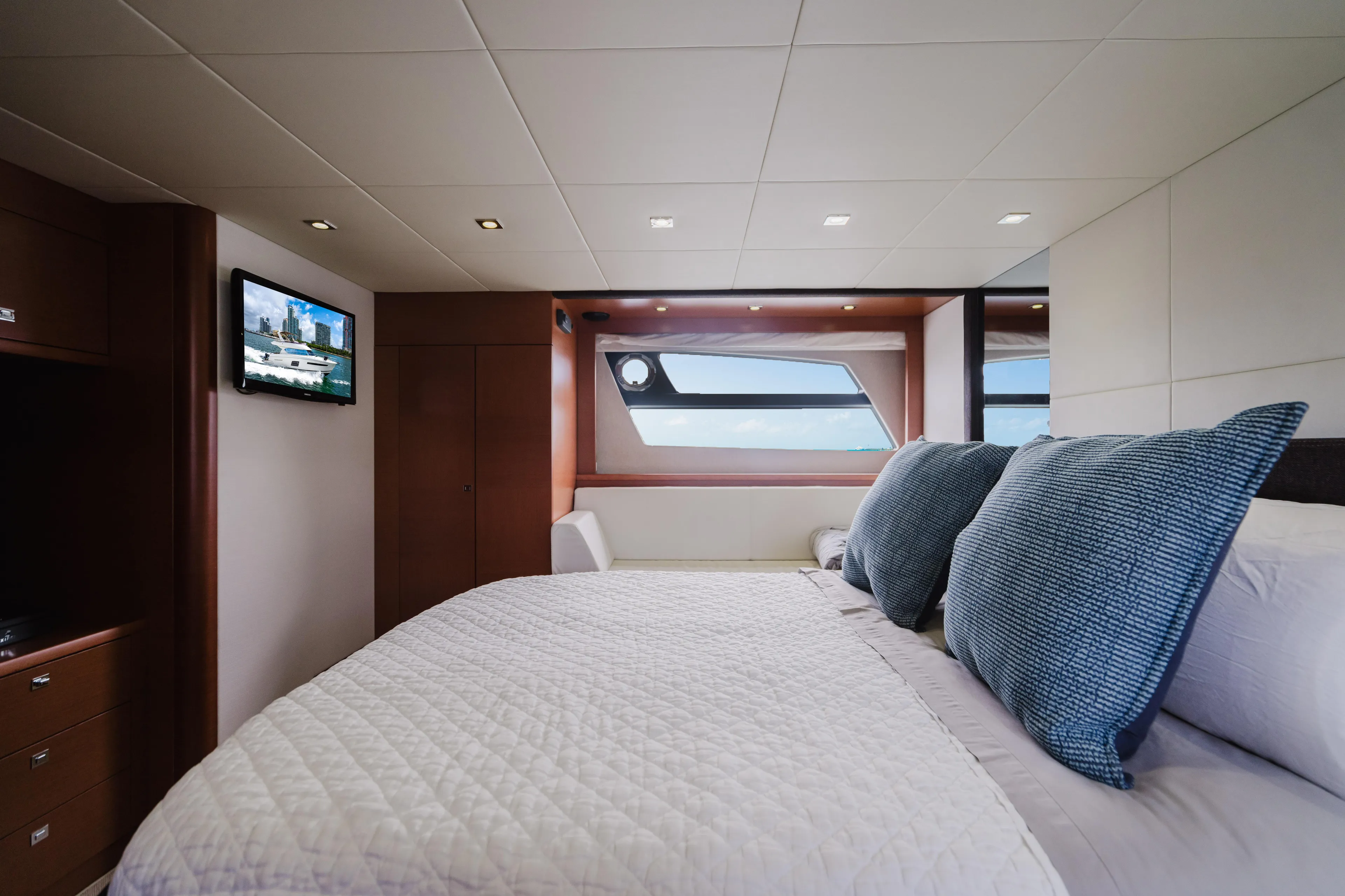 Worldwide Yacht Photos Pics Luxurious bedroom interior of 2014 Prestige 620 Fly yacht with modern decor and window view.