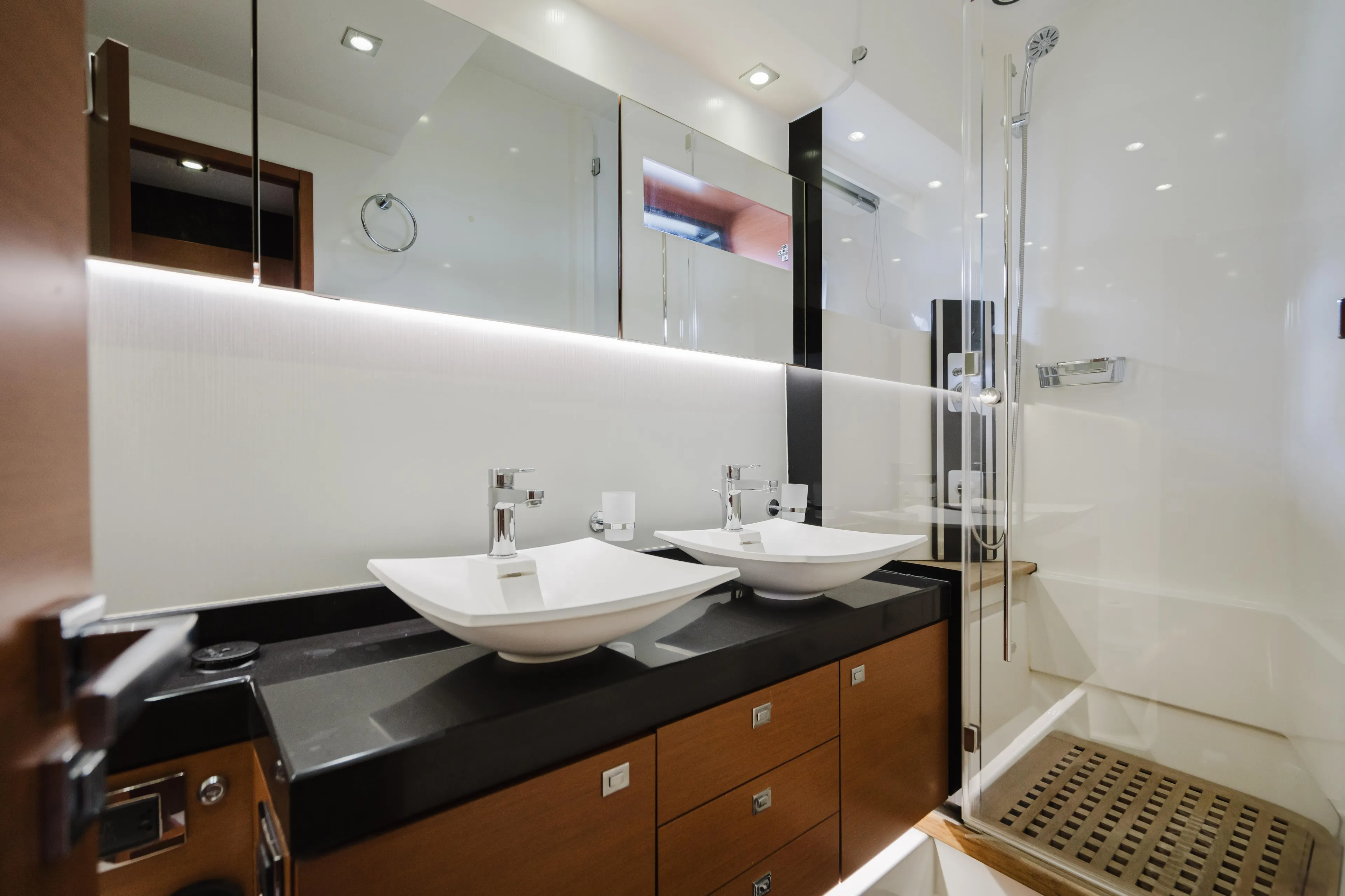 Worldwide Yacht Photos Pics Luxurious bathroom interior of 2014 Prestige 620 Fly yacht with dual sinks and modern shower.