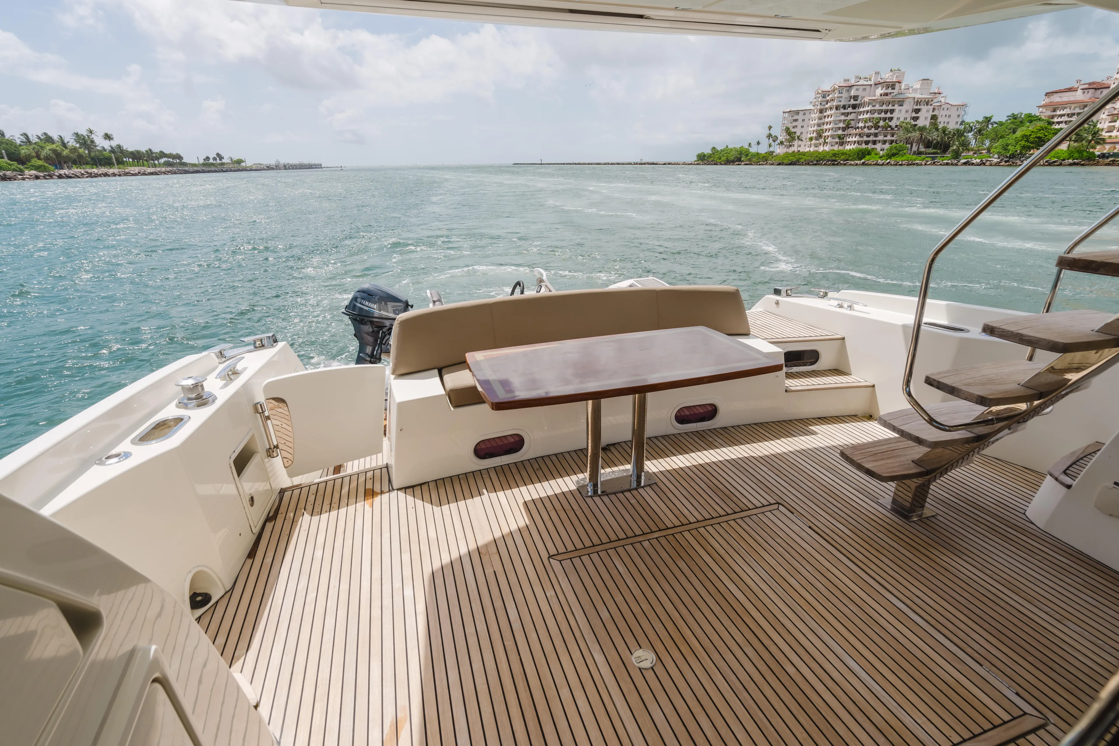 Worldwide Yacht Photos Pics Luxury 2014 Prestige 620 Fly yacht deck with ocean view and elegant seating area.